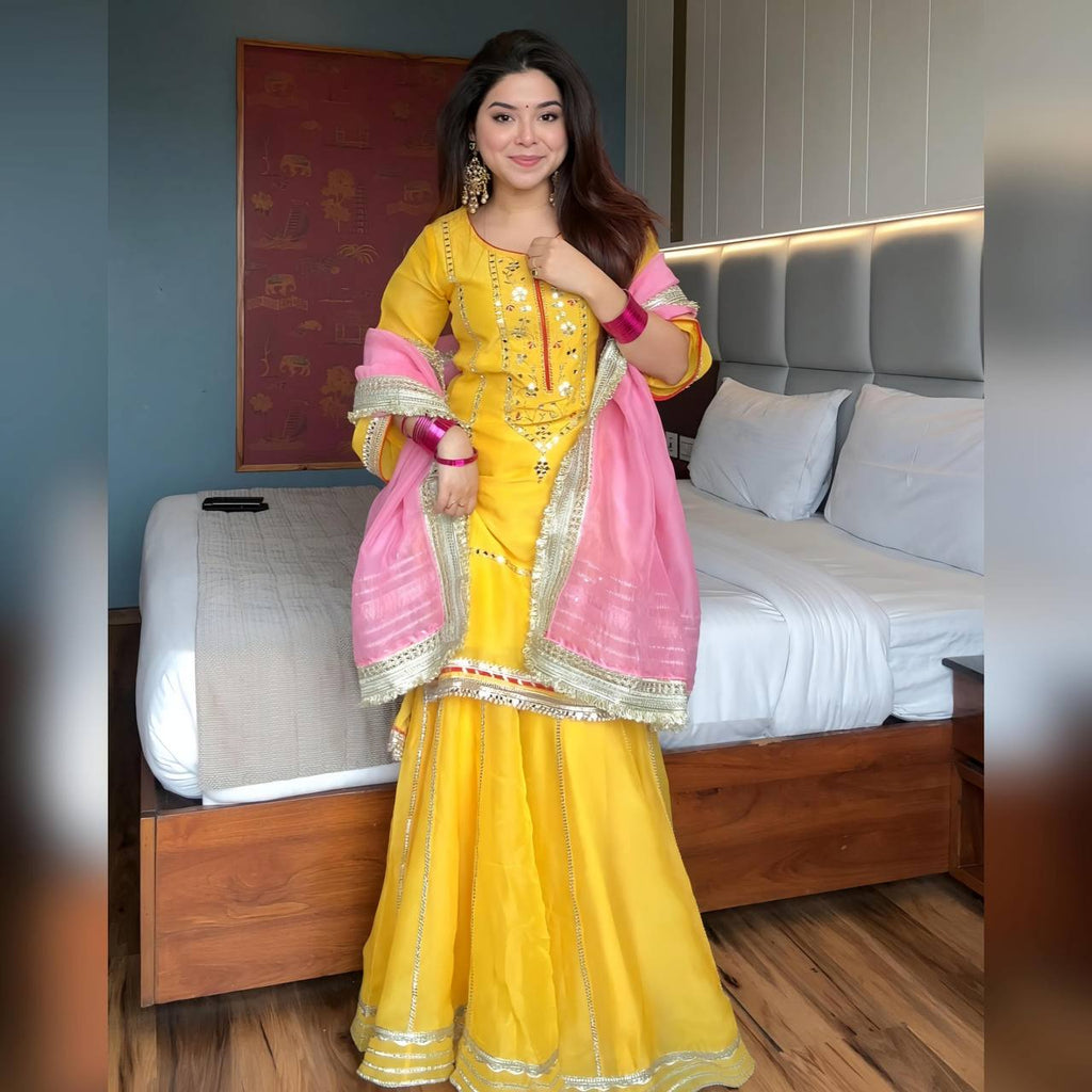 Women's Mustard Yellow Faux Georgette Embroidered Sharara Set with Contrast Pink Dupatta