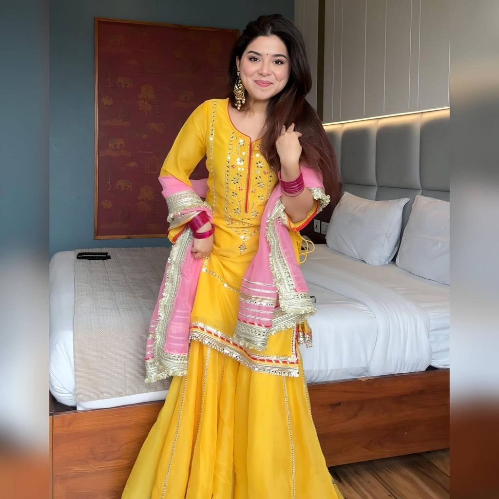 Women's Mustard Yellow Faux Georgette Embroidered Sharara Set with Contrast Pink Dupatta