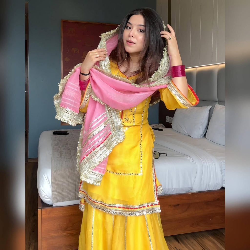 Women's Mustard Yellow Faux Georgette Embroidered Sharara Set with Contrast Pink Dupatta